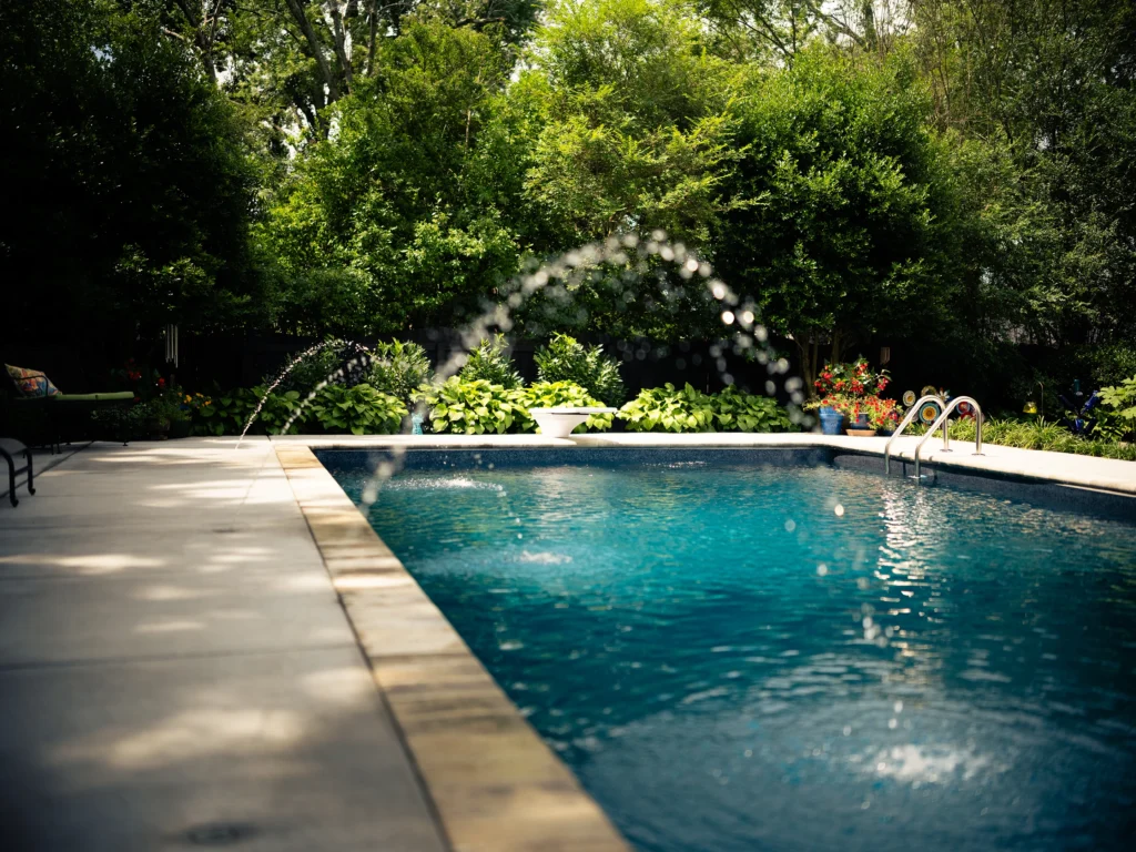 A fountain sprays into a dark blue pool in murfreesboro TN